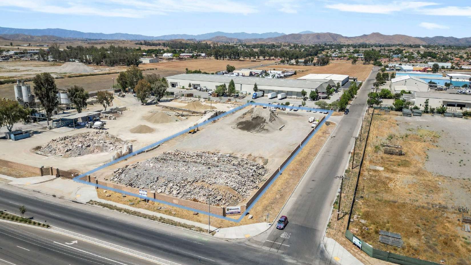 Drone photograph of the yard from the Goetz Road side with the parcel line drawn in blue